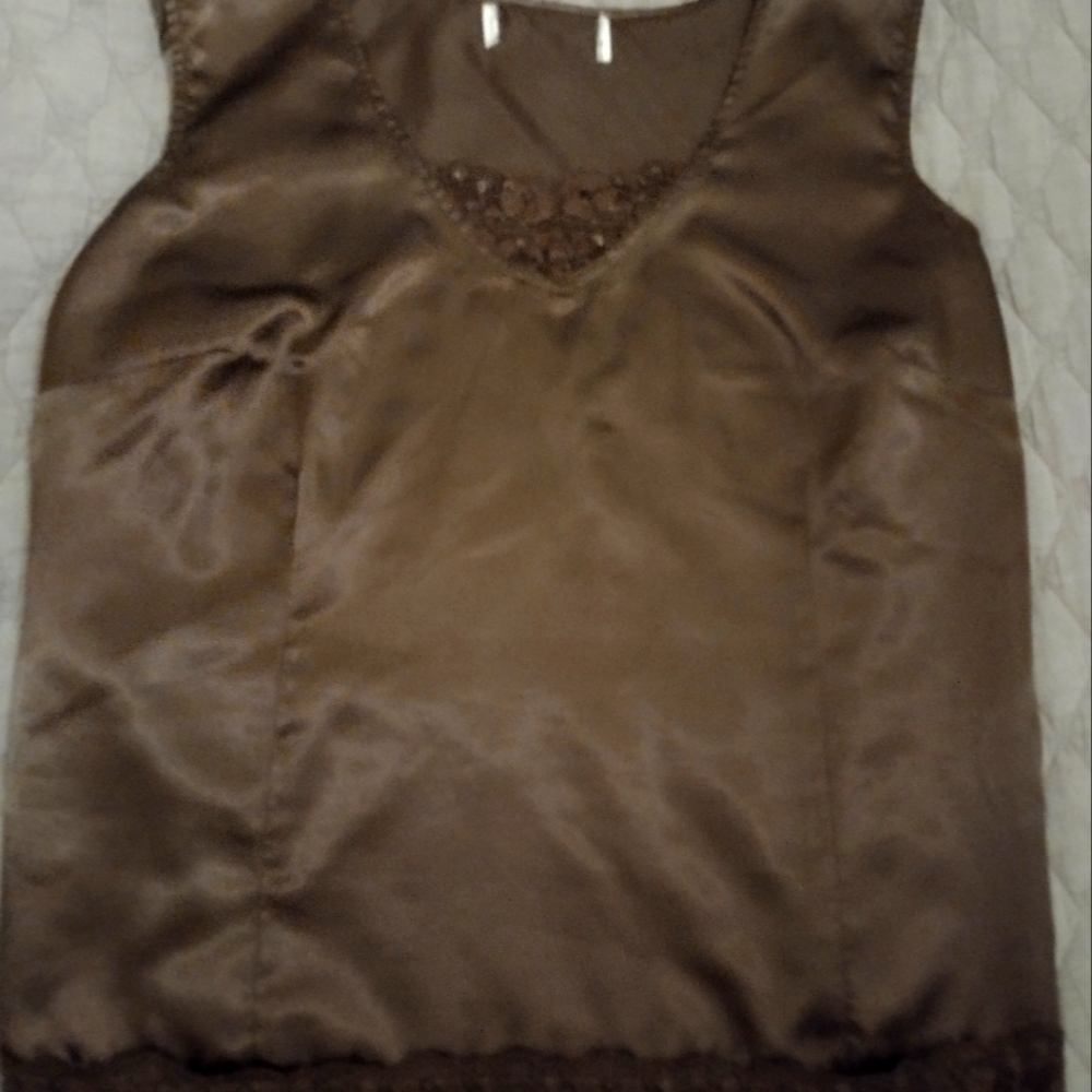 Polyester blouse but looks and feels like satin.